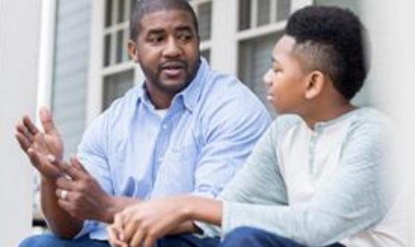 African american dad speaking to son
