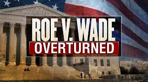 a sign that says Roe V Wade Overturned